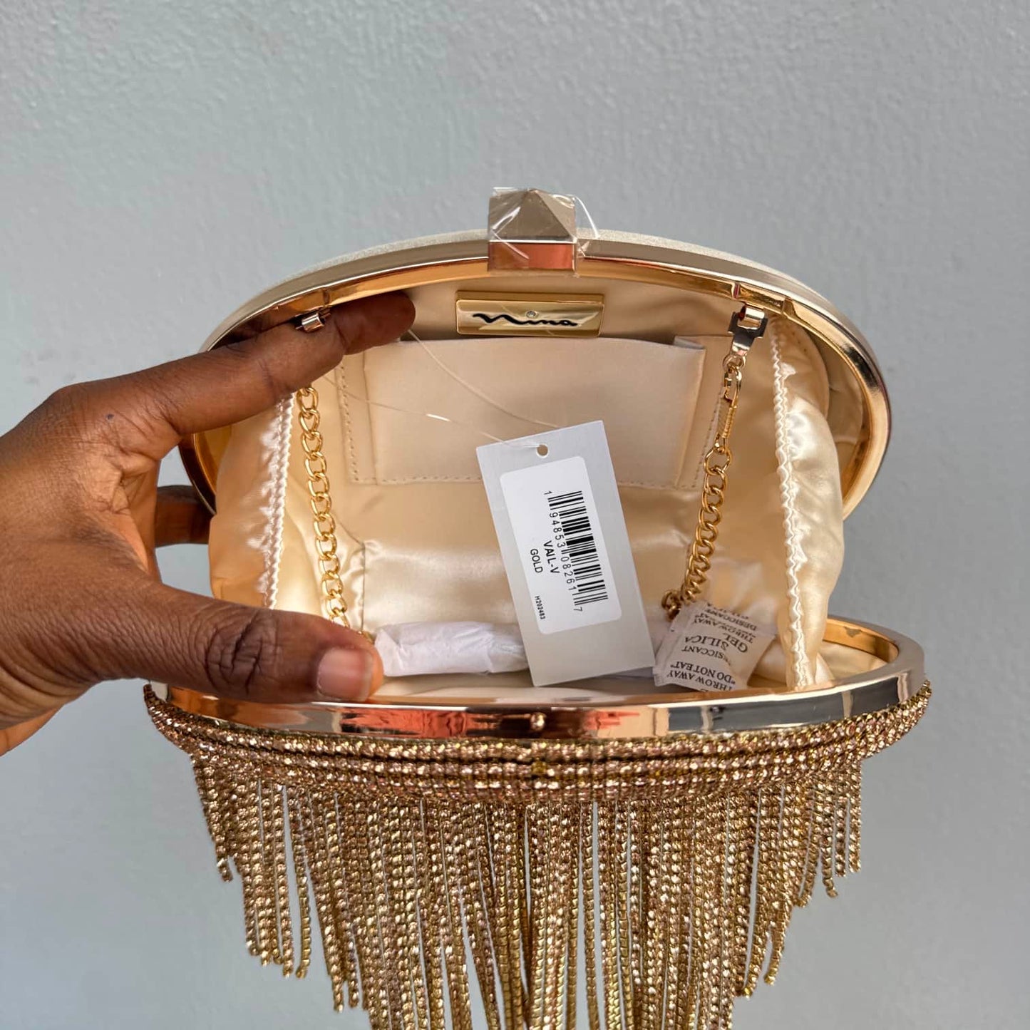 Nina Tassel Embellished Oval Clutch Purse